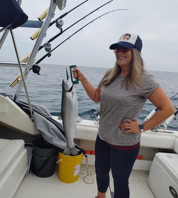 woman holding fish lake michigan